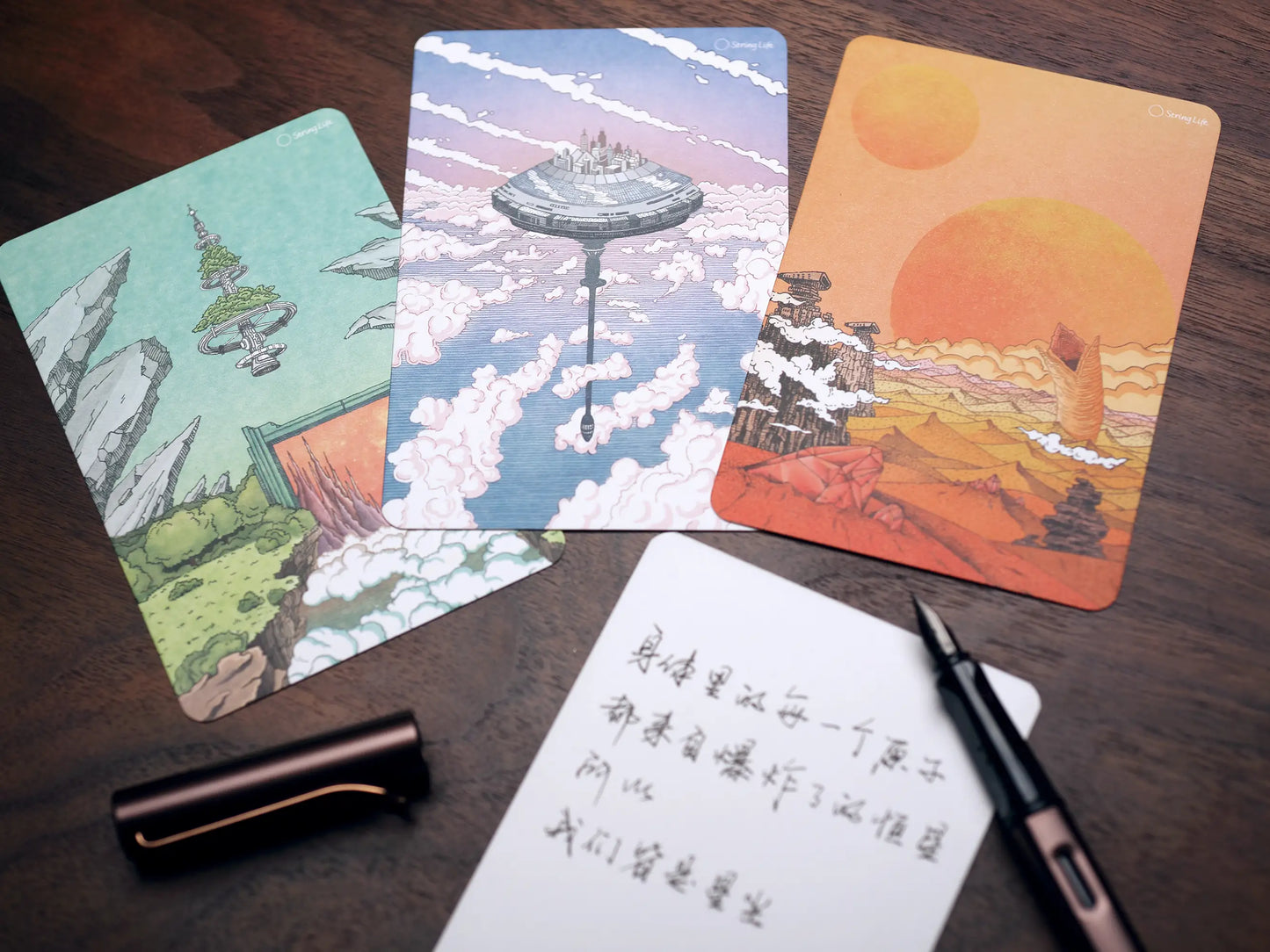 A collection of three beautifully illustrated space-themed postcards.