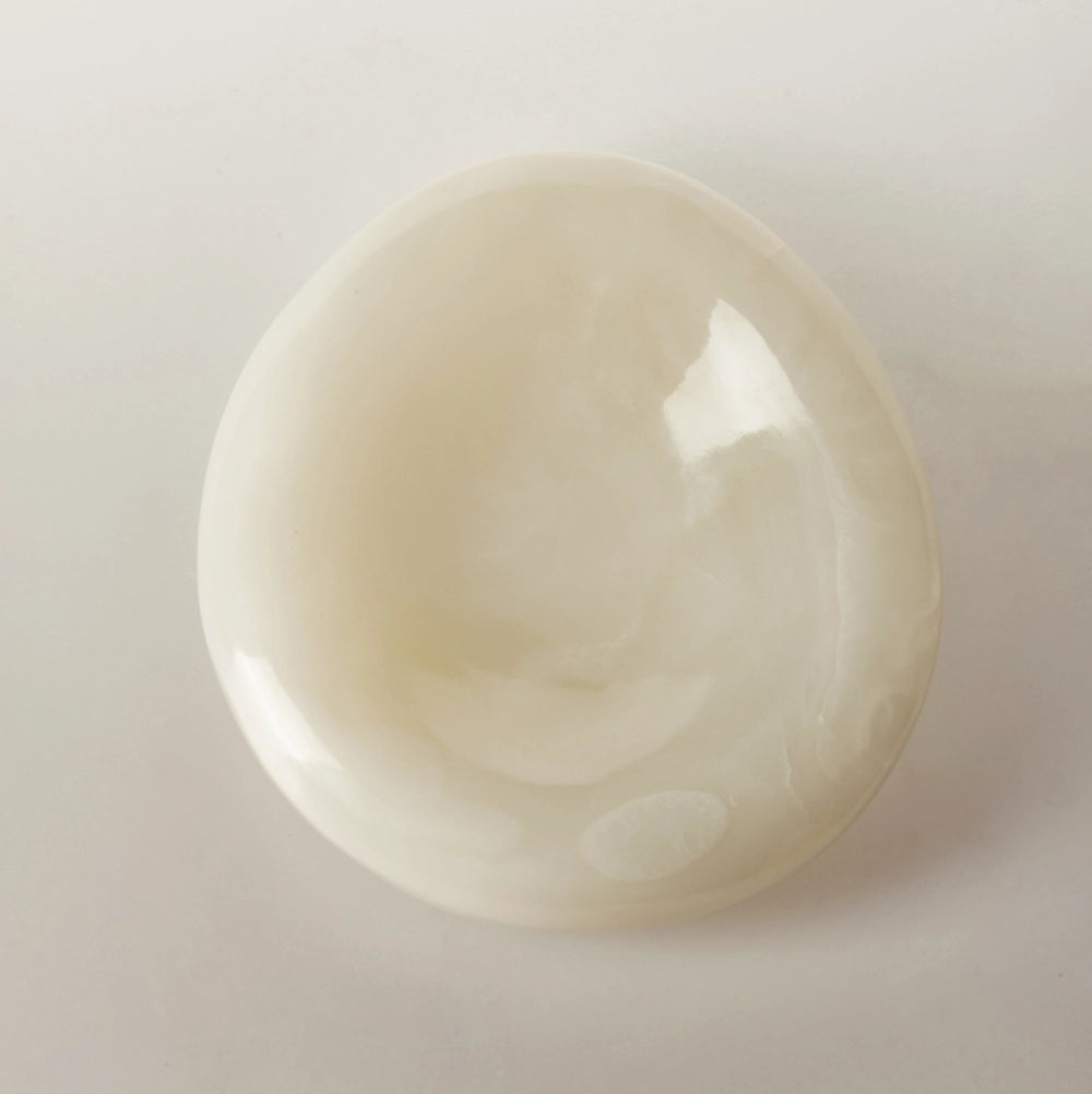 A top-down view of a single Veined Stratus alabaster bowl, showcasing the subtle, smoky swirls within the translucent stone.