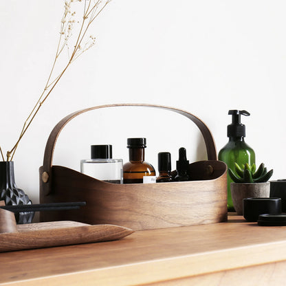 A dark walnut bentwood organizer caddy on a modern wood console.
