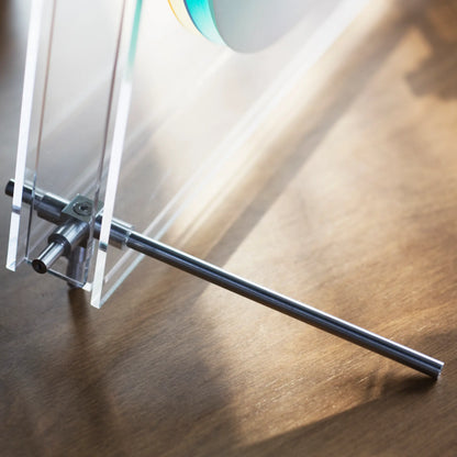 Close-up of the metal hardware on the acrylic clock frame.