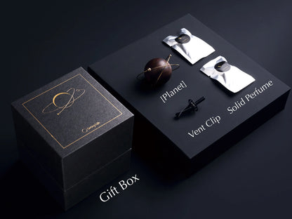 The complete car diffuser gift set: planet, vent clip, and perfume packets.