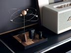 The galaxy diffuser on a black tray next to a Marshall speaker.