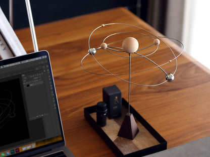 The maple wood version of the kinetic diffuser on a modern desk.