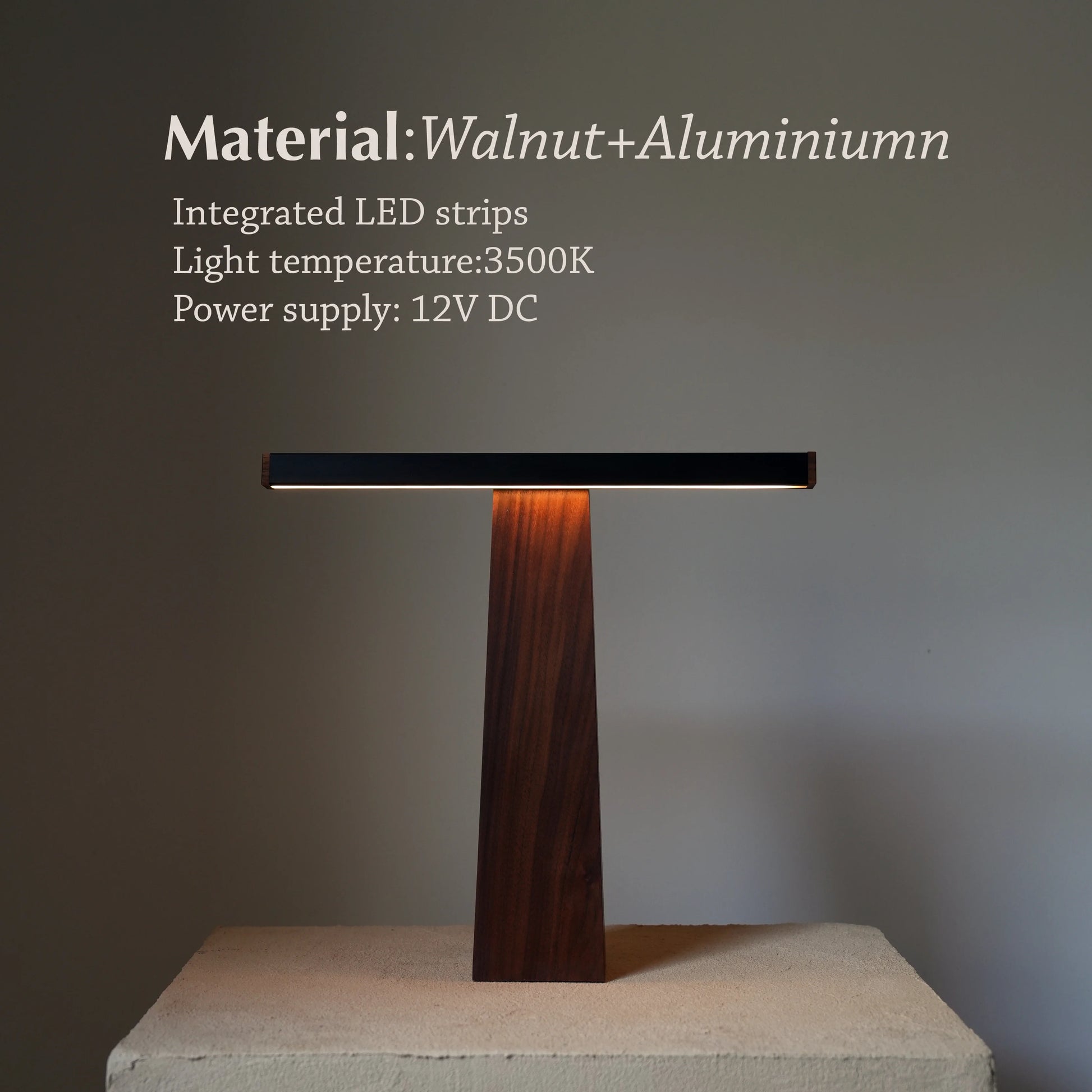 Full-frontal view of walnut and aluminum desk lamp with light temperature noted.