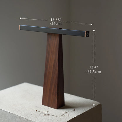 Dimensions of the sculptural walnut lamp: 34cm width, 31.5cm height.
