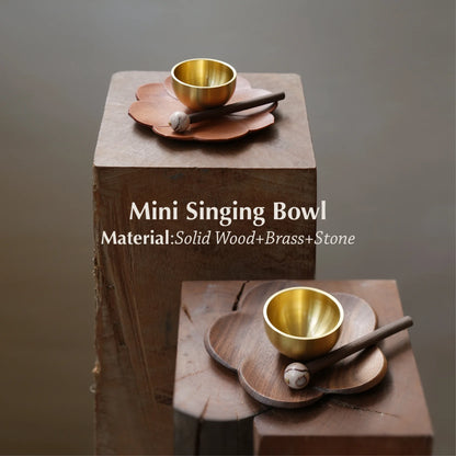 Two mini brass singing bowl sets on wooden blocks with text overlay.