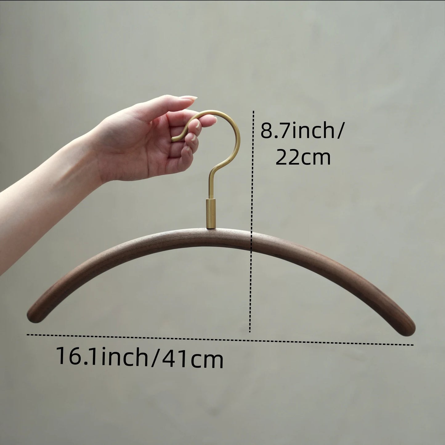 Diagram of a walnut clothes hanger with dimensions: 16.1 inch width.