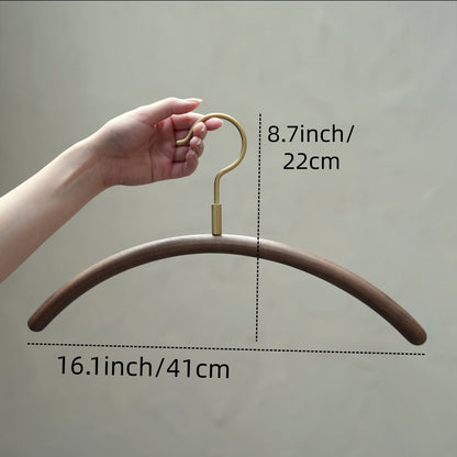 Diagram of a walnut clothes hanger with dimensions: 16.1 inch width.
