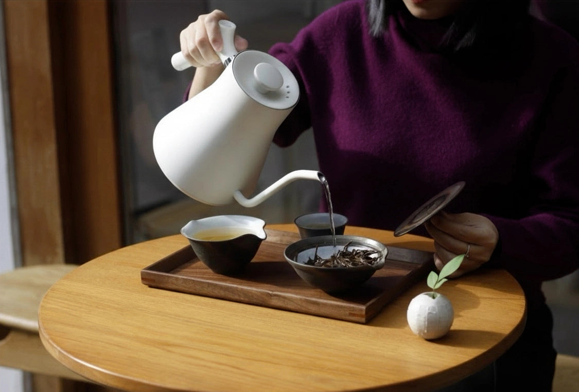 Walnut tea tray with tea bowls, person pouring hot water, ceremony