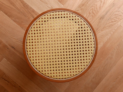 Top-down view of the hexagonal handwoven rattan pattern on the stool.